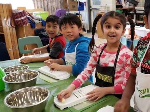Student safely exploring and learning in the kitchen