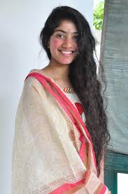 Her strawberry blonde hair is beautiful, voluminous and long. South Indian Actress Sai Pallavi Long Hair In White Dress Actress Album