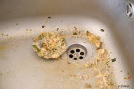 dirty clogging kitchen sink drain with