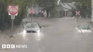 Watch: Flash flooding interrupts half-marathon, submerges cars