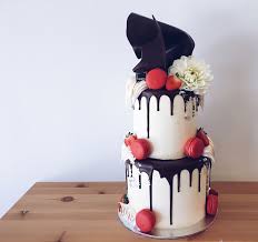 Black And White Drip Cake Ideas Black White Cake With Dark Chocolate Drip Red Macarons White Flowers Touches Of Silver Leaf To Add Bling Haranspatiss Red Birthday Cakes Drip Cakes Cake