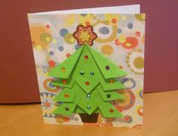 This origami christmas wreath card design is made from 8 paper folded pieces that are glued together at the end. How To Make An Easy Origami Christmas Tree Card Origami Christmas Tree Card Xmas Cards Design Creative Christmas Cards