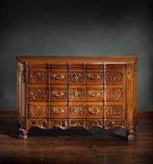 White chest of drawers with black handles and sharp contrasting shadows, part of the interior furniture. Chest Of Drawers Wikipedia