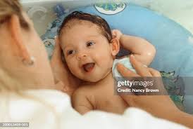 246 Mom Giving Child Bath Stock Photos, High-Res Pictures, and Images