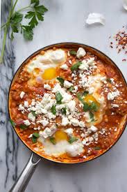 As i was eating dinner last night i envisioned the leftover couscous with a steamed egg and a bit of bacon, parmesan, and parsley sprinkled on top. Shakshuka With Feta And Couscous Recipe By Molly Yeh