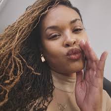 Demetria McKinney is feeling happy.