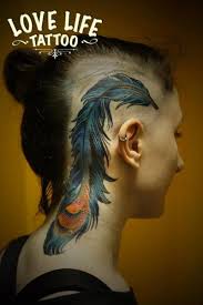 It expresses how loved the person was. Realistic Feather Head Neck Tattoo By Love Life Tattoo