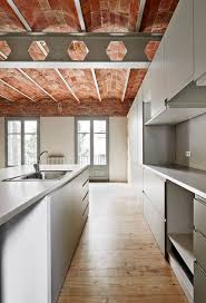 It is said that nobody is truly home until they have a roof over their head. Vaulted Brick Ceilings Revealed Inside Barcelona Apartment Renovation