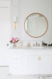 Modern White Bathroom With Gold Hardware And A Round Vanity Mirror Designed By House Of Jade Via Beautiful Bathrooms Bathroom Inspiration Decor Inspiration