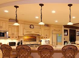 Recessed lighting on a dimmer can light the kitchen with both ambient overhead lighting and task lighting. Installing Pendant Lights Over Kitchen Islands Livewire