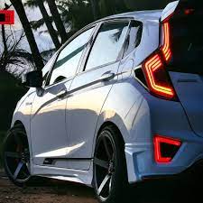 (super black coat) with red ssr gt forged lug nuts and wrapped by a set of 215/35r18 falken fk453 tires. White Honda Jazz On Mugen Full Body Kit Modifiedx