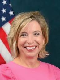 raw_arguments.field_department_target_id|title|replace({'-': ' '}) }}