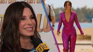 Sandra Bullock Jokes Her Purple Sequin Jumpsuit Is The Real Star Of The Lost City Exclusive Robetnews