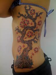 It can be easily flaunted with the right combination of colors and it definitely looks good on all parts of a woman's body. 30 Tree Rib Cage Tattoos