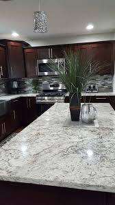 A variegated stone backsplash combines the tan and grey to create a striking visual interest along the walls. 23 Ideas Kitchen Floor Tile With Oak Cabinets Range Hoods Home Decor Kitchen Backsplash With Dark Cabinets Home Decor