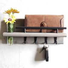 A colorful framed photo of a farm hangs cheerfully between them. 35 Best Key Holder Ideas And Designs For 2021