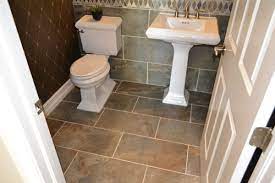 Insert spacers to keep the tiles separated and allow room for grout. Big Tile Or Little Tile How To Design For Small Bathrooms And Living Spaces On Suncoast View Tile Outlets Of America