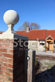 The gate piers are in stone and each has a chamfered projecting base, and a cap with a ball historic england, gate piers and gates approximately 25 yards north east of chancel of church of st. Red Brick Gate Post Stone Ball Finial Pier Cap Barn Conversi Stock Photos Freeimages Com