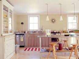 A fusion quartzite island countertop and range backsplash make the kitchen all the more dynamic and inviting. Warm Modern Kitchen Design Ideas And Unique Accents Personalizing Kitchen Interiors