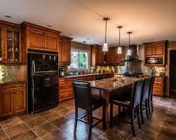 Traditional kitchen style with a variety of black kitchen cabinets, stainless steel appliances, large white rectangle sink and beige/dark brown granite surfaces. Black Kitchen Appliances Decoration Ideas 26 New Ideas Download