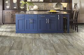 Whether you choose to go with a light or dark this dark hardwood floor is matched wonderfully by the dark center island. 2021 Kitchen Cabinet Trends 20 Kitchen Cabinet Ideas Flooring Inc
