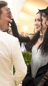Elon musk and grimes attend the heavenly bodies: Grimes And Elon Musk Update Their Child S Perplexing Name Vanity Fair