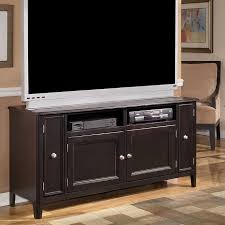 Home > furniture collections > ashley furniture is american furniture # 1 company > ashley furniture living room > ashley furniture tv stands this tv stand allures with the glitz and glam befitting silver screen queens. Carlyle 60 Inch Tv Stand Signature Design By Ashley Furniture Furniturepick