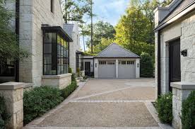An Atlanta Residence Blends Traditional Detailing With Modern Simplicity Transitional House Stone Cottage Homes Farmhouse Style House