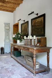 A comfortable armchair sits at one end of the table and a bench sits along one side. Shabby Chic Modern Rustic Interior Decoholic Rustic Interiors Modern Rustic Interiors Shabby Chic Modern