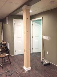 To cover basement poles, you can first enclose them in wooden or drywall structures and then paint, wallpaper, or carpet this. Image Result For Encasd Metal Support Poles Basement Remodeling Basement Bedrooms Basement Design