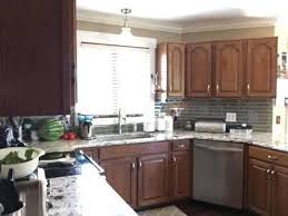 Refinishing cabinets costs $2,852 on average with a typical range of $1,754 and $3,990. Kitchen Cabinet Refinishing Before After Shelly S Kitchen Painting
