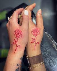 Pink rose dainty hand tattoo. Bestfriends Forever Inkkbyjv Atltattoo Atlantatattoo Atltatttooartist Atlantatattooartist Atli Red Ink Tattoos Red Tattoos Finger Tattoos