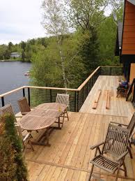 Maybe you would like to learn more about one of these? Lake House In Montreal Canada Elevated Deck Update With Cable Railing System From Stainless Cable Raili Deck Railings Deck Railing Design Wood Deck Railing