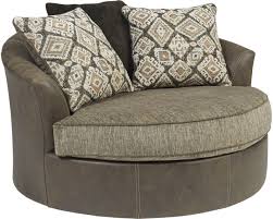 A barrel chair is a round chair often compared to the shape of a barrel, hence the name. Signature Design By Ashley Abalone Chocolate Oversized Swivel Accent Chair 9130221 Goedekers Com