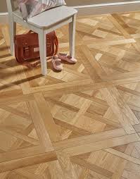 This includes stunning designs in a number of colours and shades such as light, dark, white and grey laminate flooring. Versailles Tiles Parquet Flooring Direct Wood Flooring