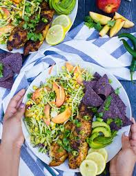 These delicious fish tacos are paired with a spicy cabbage slaw. Fish Taco Recipe Bowl With Peach Slaw Two Purple Figs