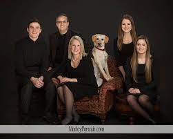 Family Portrait With A Dog In The Studio On A Black Background Photography By Kathy Mor Studio Family Portraits Family Portrait Outfits Family Portrait Poses