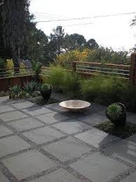 I Really Like The Gravel And Patio Paver Combo But I Like Low Maintenance And This May Drive Me Crazy Pea Gravel Patio Concrete Paver Patio Modern Landscaping
