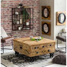 A trunk coffee table may be made of leather or wood, and may be embellished with metal or leather straps and drawer openers. Storage Coffee Table Trunk Rustic Solid Wood