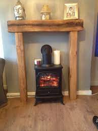 fire place solid french oak beam surround mantle shelf rustic country cottage wood burning stoves living room fireplace surrounds small floating bedside table