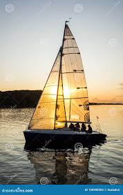 Sailing Boat Sailing into the Harbor during Beautiful Sunset with the Sun  Shining through the Sail Editorial Photography - Image of sailboat, cruise:  159590302