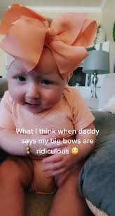 Dad Makes Fun of Baby with Big Bow