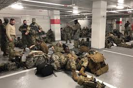 Us president joe biden has apologised after some members of the national guard stationed at the capitol were pictured sleeping in a car park. Rlk N A6gjylym