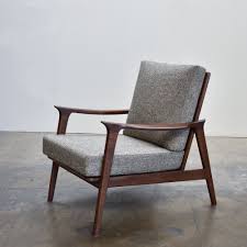 Create an inviting atmosphere with new living room chairs. Mid Century Arm Chair Gingko Home Furnishings