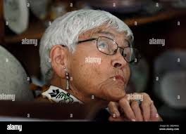 Carol Kramer, of Newton, Iowa, listens to Democratic presidential candidate  Sen. Cory Booker, D-N.J., speak during a house party in her home, Friday,  May 24, 2019, in Newton, Iowa. (AP Photo/Charlie Neibergall