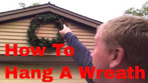If your wreath is light enough, double sided tape should be plenty (although you might want some rubbing alcohol to get rid of any marks left over). How To Hang A Wreath On A House With Vinyl Siding Or Stucco Youtube