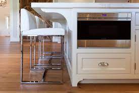 Picking the right counter stools can not only alter the ergonomics of your modern kitchen, but also add to the visual aesthetics as well. White Kitchen Island With Modern White Counter Stools Transitional Kitchen