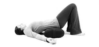 Restorative Yoga For Low Back Tension Supported Bridge Pose With Bent Legs Yoga To Energize Heart And Throat Ch Bow Legged Bow Legged Correction Bridge Pose