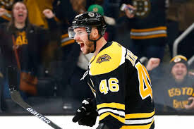 David krejci, holding two pieces of bread on either side of jake debrusk's head: Boston Bruins David Krejci I Want To Play But I Don T Want To Be Away From My Family For Two Or Three Months Masslive Com