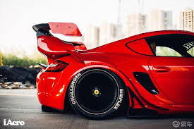 If you think that you may want to reverse back to stock when you sell your vehicle, a wide body kit is not for you. Red Porsche Cayman 987 With Extreme Widebody Kit